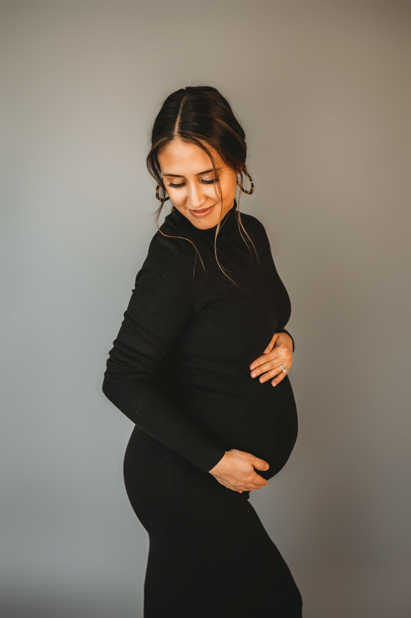pregnant mom cradles belly peoria maternity photographer