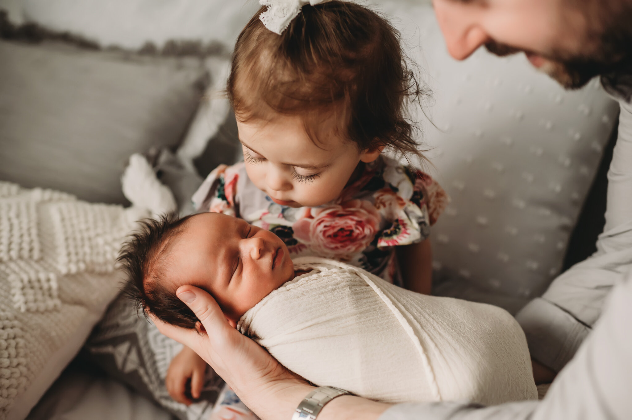 Peoria Illinois newborn photographer sibling kisses baby brother.jpg