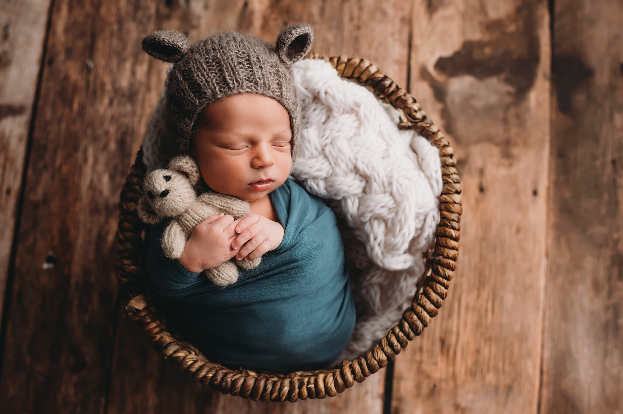 Peoria newborn photographer, baby poses in basket with teddy bear.jpg