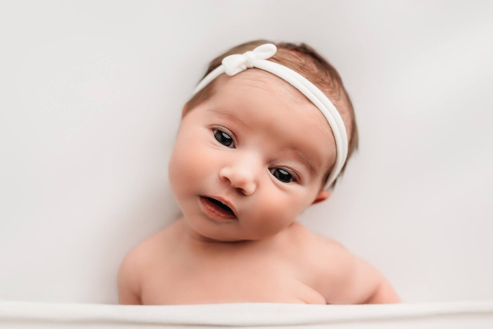 Peoria IL newborn photographer white background baby face