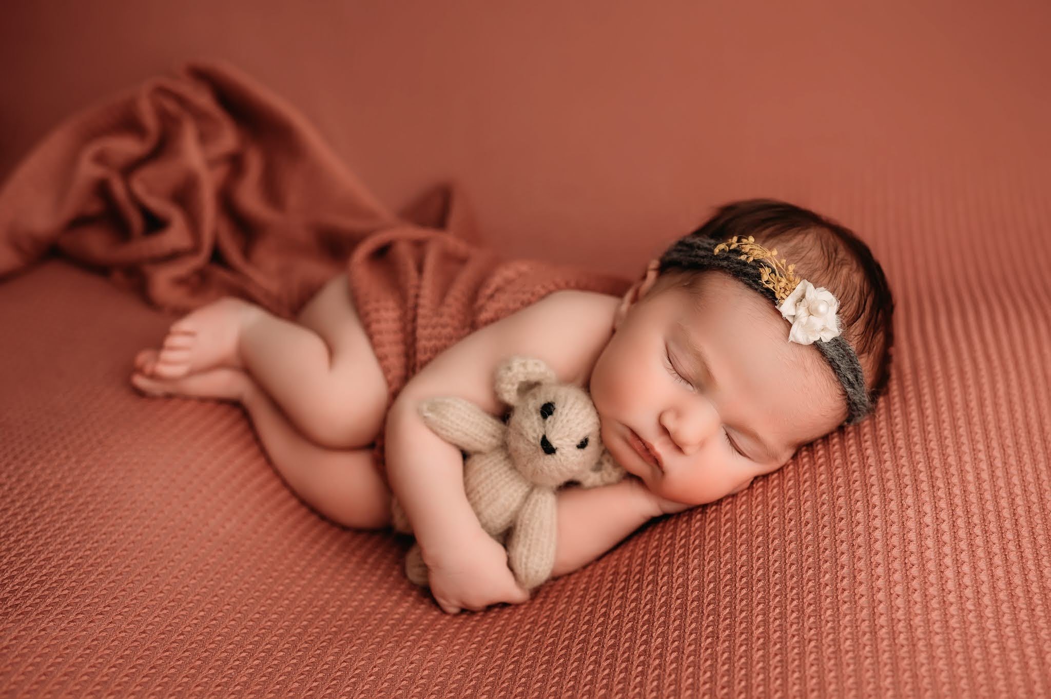 Peoria Il newborn laying with teddy bear photo.jpg