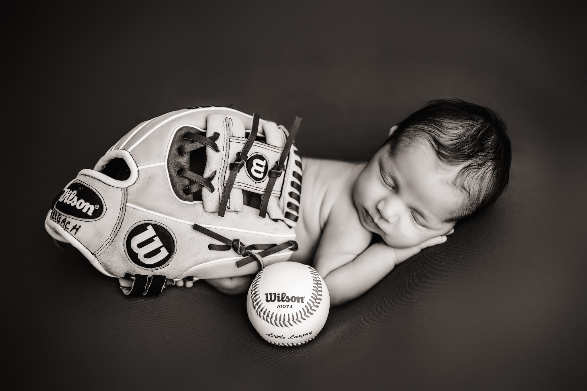 Newborn with baseball glove.jpg