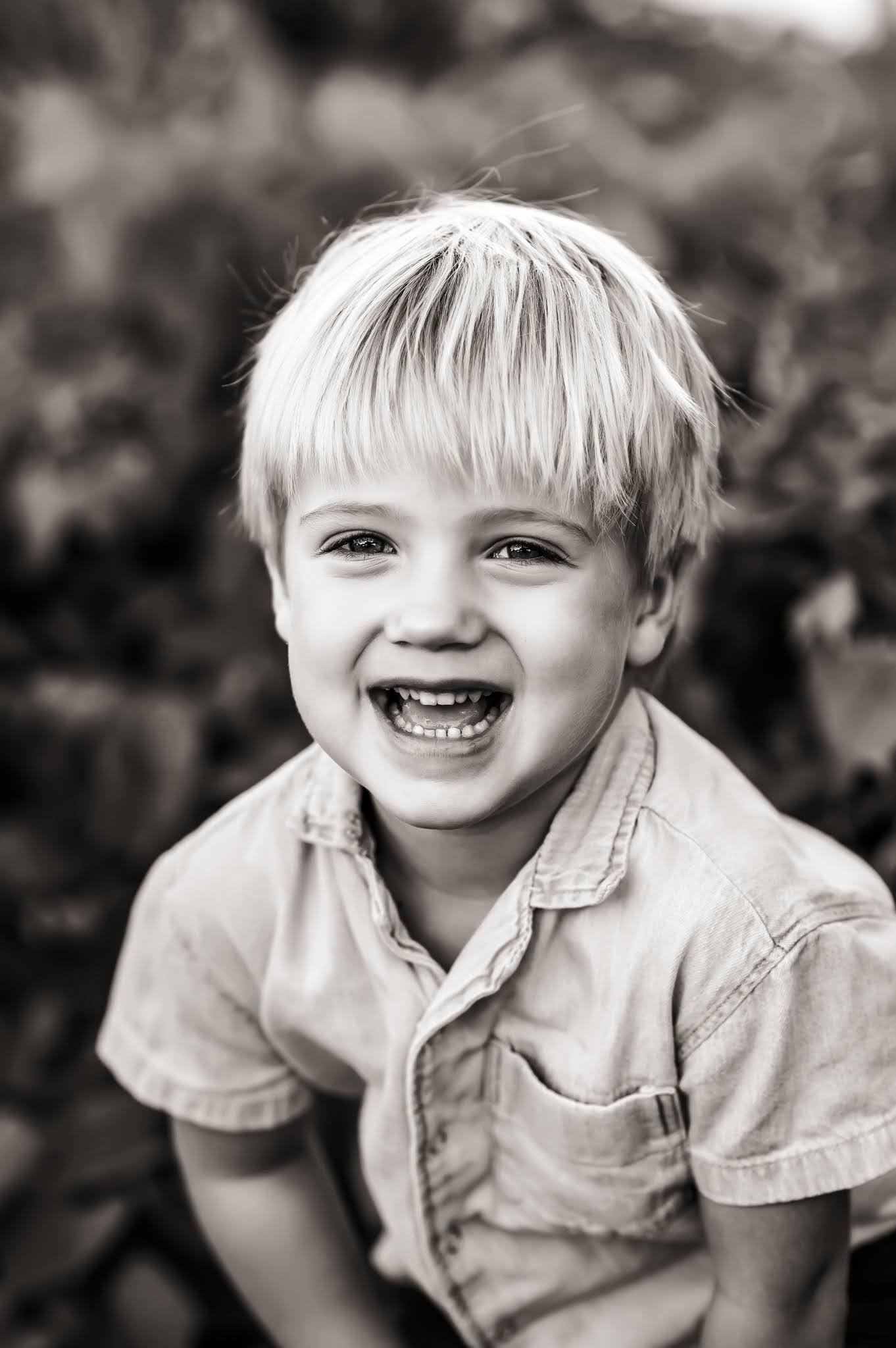 Black and white little boy laughing.jpg