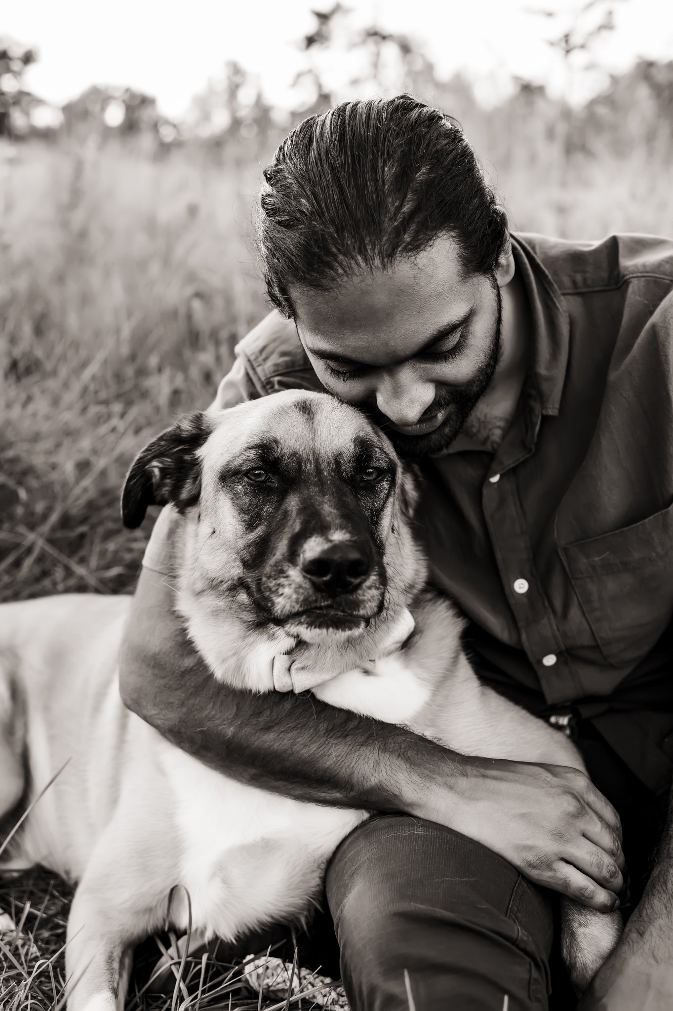 black and white man hugging dog.jpg