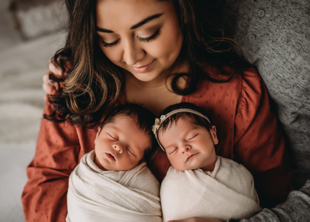 Twin mom holds boy and girl twins