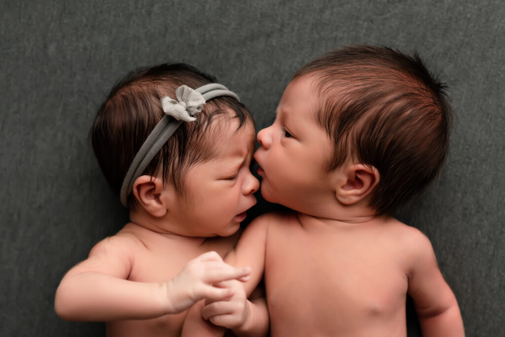 newborn baby twins lay together