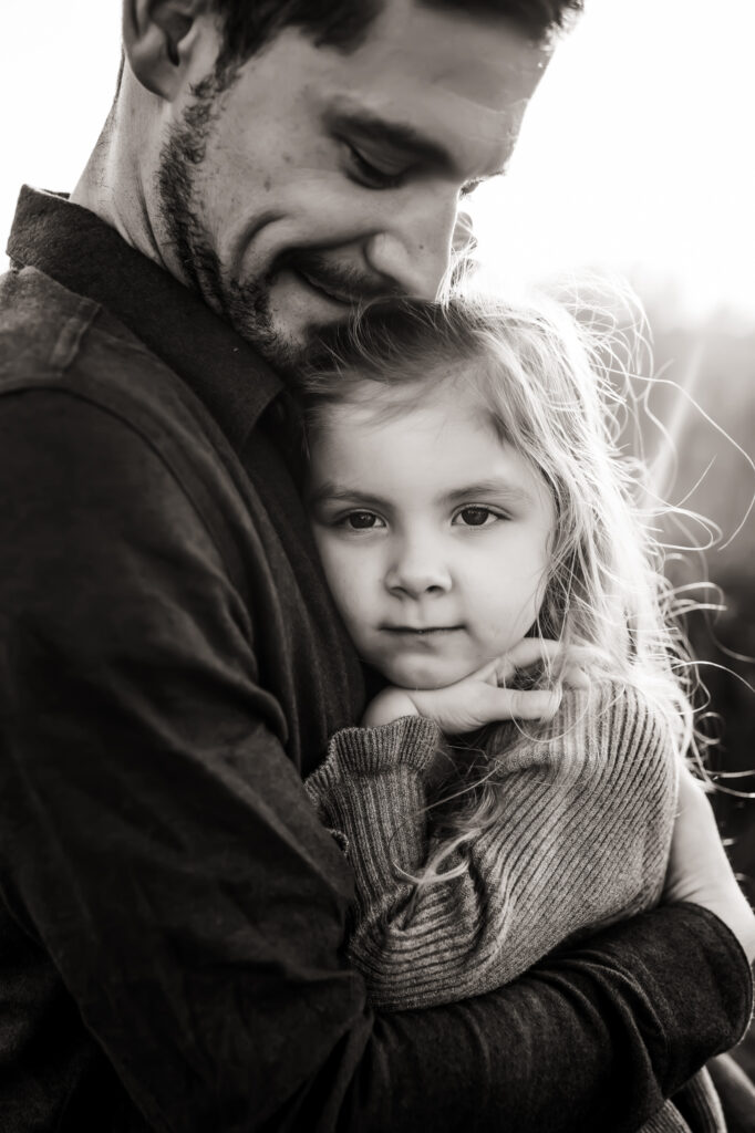 black and white daughter hugs dad princeville photographer